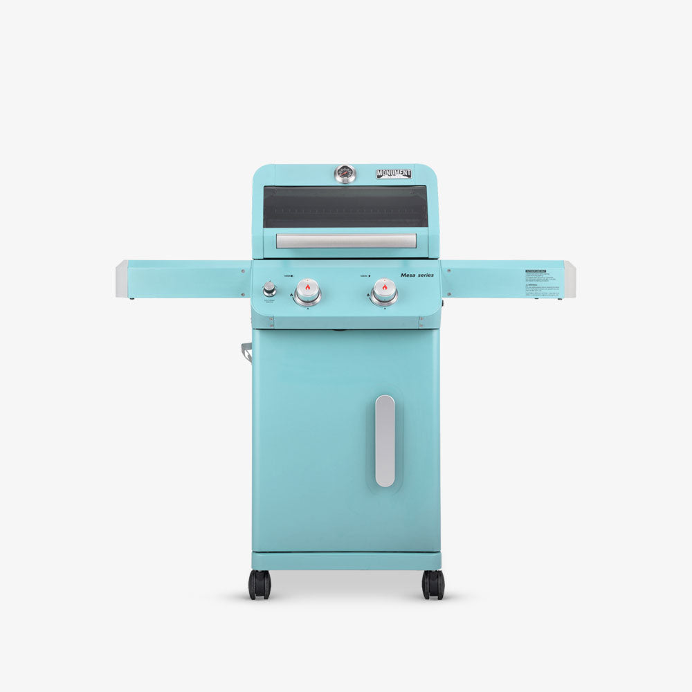 A blue-colored, two-door outdoor gas grill with a visible control knob on top and set on a white background.