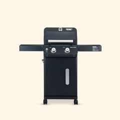 Black barbecue grill on a beige background