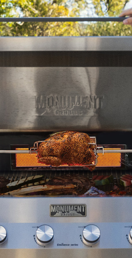 Monument grill with a roasted turkey on a grill grate outdoors