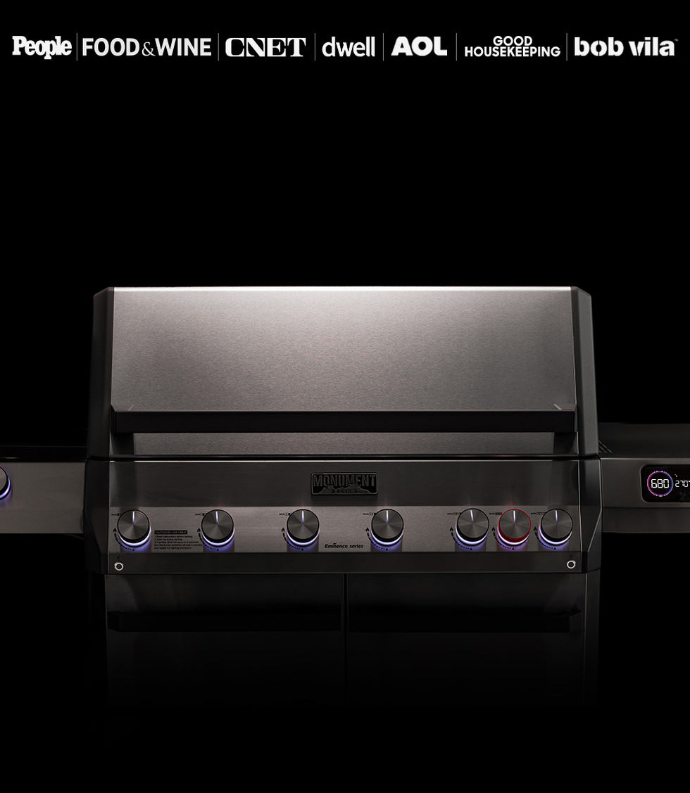 Black grill with multiple control knobs on a dark background