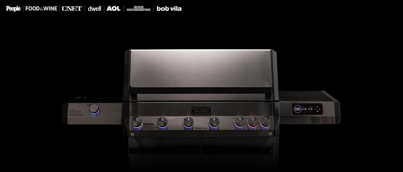 Black grill with multiple burners on a white background