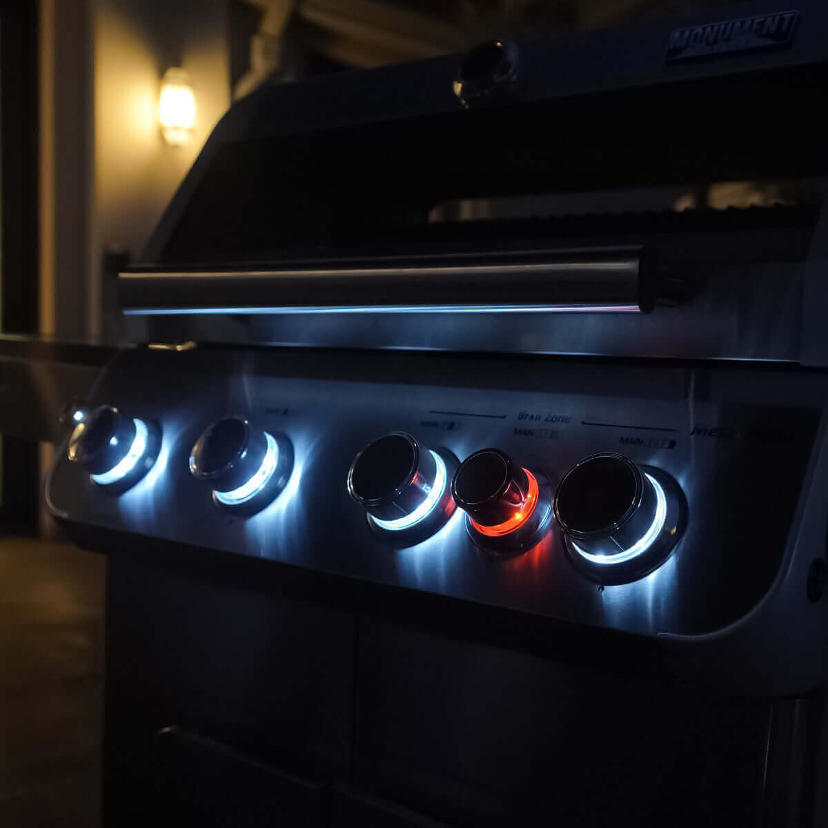 Mesa 415BZNG | Stainless Natural Gas Grill knobs glowing in the dark, showcasing advanced lighting and design
