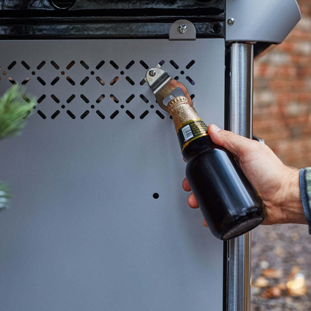 Mesa 415BZNG | Stainless Natural Gas Grill bottle opener in use with a beverage