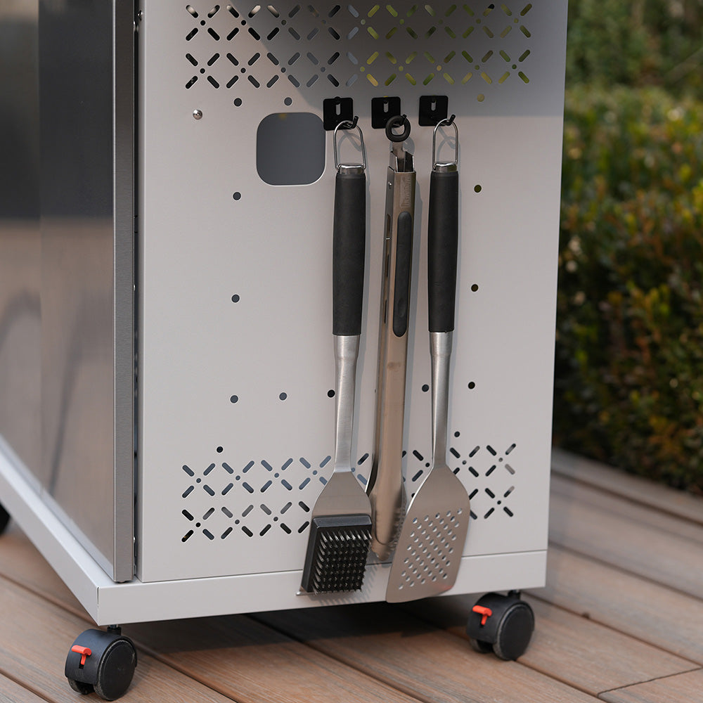 Mesa II 410BZ | Stainless Propane Gas Grill tools hanging on storage side, including spatula and grill brush.