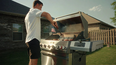 Man grilling outdoors on a sunny day