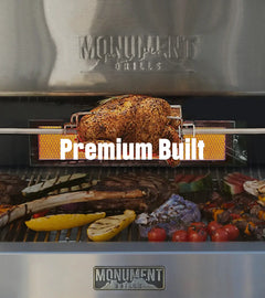 Grill with food being cooked, featuring 'Monument Grills' branding.