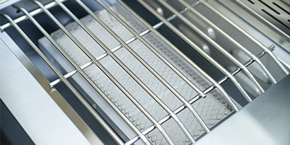 Close-up of a metal grill with a white background