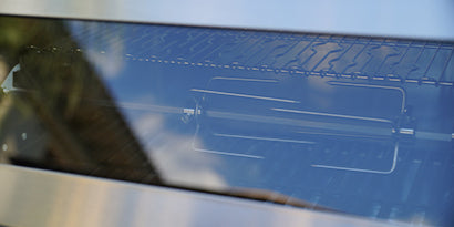 Close-up of a metallic surface with texturing and reflective properties