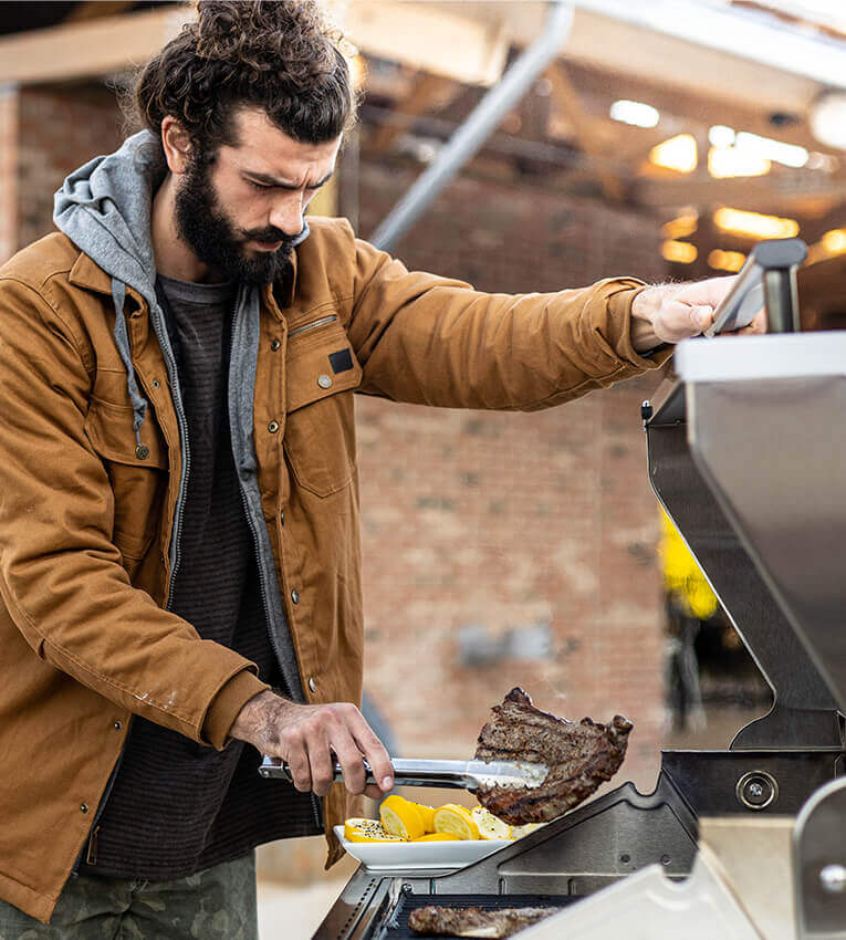 Griller preparing a meal outdoors